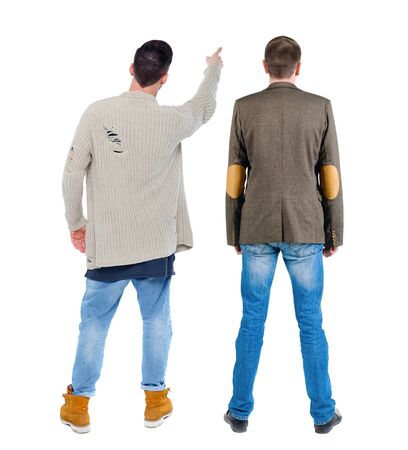 Back view of two man in sweater pointing. Rear view people collection. backside view of person. Isolated over white background.の写真素材