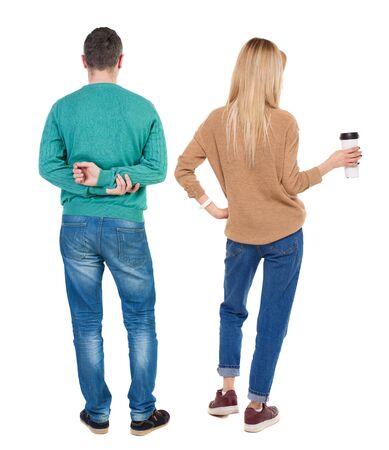 Back view of couple in sweater. beautiful friendly girl and guy together. Rear view people collection. backside view of person. Isolated over white background.の写真素材