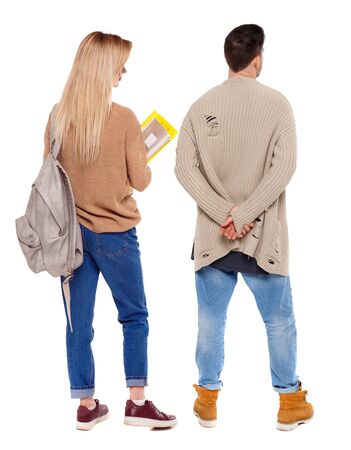Back view of couple in sweater. beautiful friendly girl and guy together. Rear view people collection. backside view of person. Isolated over white background.の写真素材