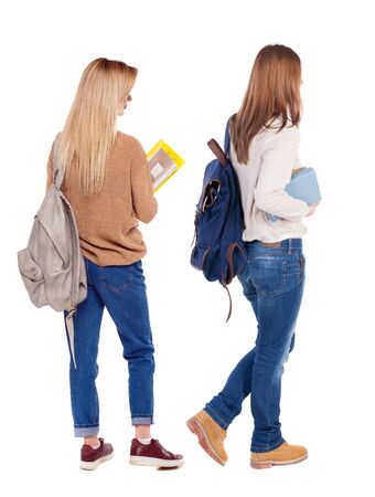 Back view of two woman in sweater. beautiful friendly girl and guy together. Rear view people collection. backside view of person. Isolated over white background.の写真素材