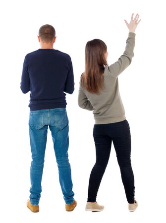 Back view of couple in sweater. beautiful friendly girl and guy together. Rear view people collection. backside view of person. Isolated over white background.の写真素材