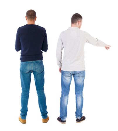 Back view of two man in sweater pointing. Rear view people collection. backside view of person. Isolated over white background.の写真素材
