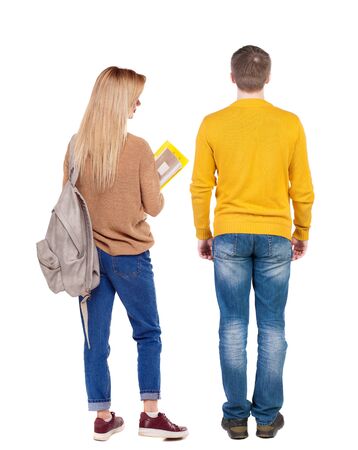 Back view of couple in sweater. beautiful friendly girl and guy together. Rear view people collection. backside view of person. Isolated over white background.の写真素材
