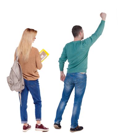 Back view of couple in sweater. beautiful friendly girl and guy together. Rear view people collection. backside view of person. Isolated over white background.の写真素材