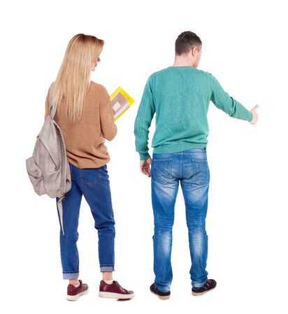 Back view of couple couple in sweater showing thumbs up. beautiful friendly girl and guy together. Rear view people collection. backside view of person. Isolated over white background.の写真素材