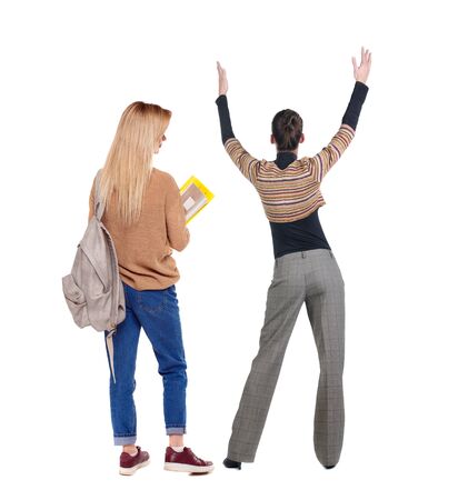 Back view of two woman in sweater. beautiful friendly girl and guy together. Rear view people collection. backside view of person. Isolated over white background.の写真素材