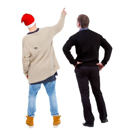 Back view of two man in sweater pointing. Rear view people collection. backside view of person. Isolated over white background.の写真素材