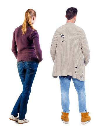 Back view of couple in sweater. beautiful friendly girl and guy together. Rear view people collection. backside view of person. Isolated over white background.の写真素材