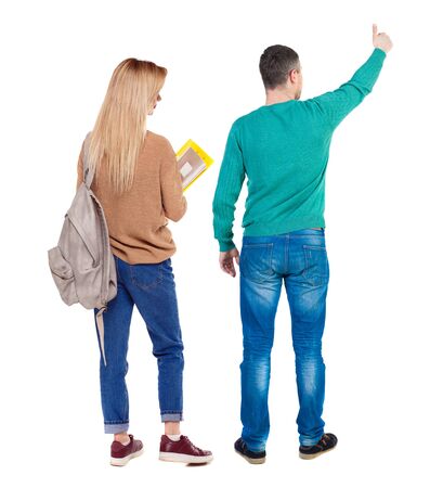 Back view of couple couple in sweater showing thumbs up. beautiful friendly girl and guy together. Rear view people collection. backside view of person. Isolated over white background.の写真素材