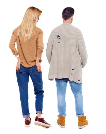Back view of couple in sweater. beautiful friendly girl and guy together. Rear view people collection. backside view of person. Isolated over white background.の写真素材