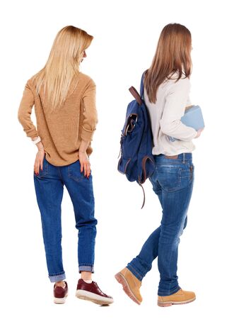 Back view of two woman in sweater. beautiful friendly girl and guy together. Rear view people collection. backside view of person. Isolated over white background.の写真素材