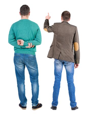 Back view of two man in sweater pointing. Rear view people collection. backside view of person. Isolated over white background.の写真素材