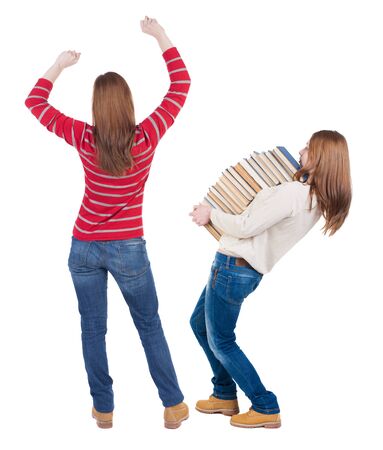 Back view of two woman in sweater. beautiful friendly girl and guy together. Rear view people collection. backside view of person. Isolated over white background.の写真素材