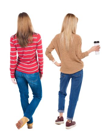 Back view of two woman in sweater. beautiful friendly girl and guy together. Rear view people collection. backside view of person. Isolated over white background.の写真素材