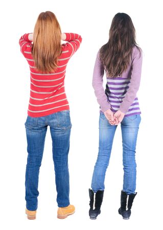 Back view of two woman in sweater. beautiful friendly girl and guy together. Rear view people collection. backside view of person. Isolated over white background.の写真素材