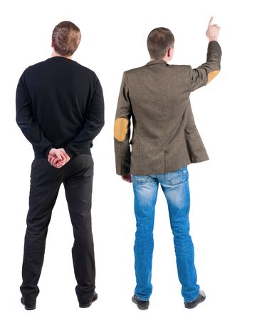 Back view of two man in sweater pointing. Rear view people collection. backside view of person. Isolated over white background.の写真素材