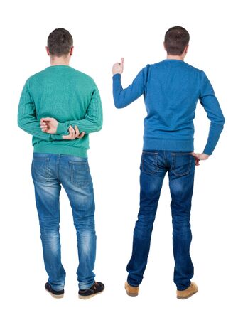 Back view of two man in sweater showing thumb up. Rear view people collection. backside view of person. Isolated over white background.の写真素材