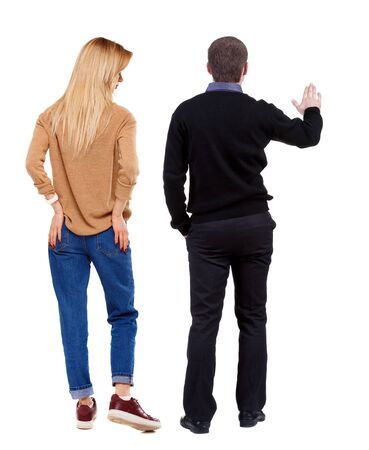 Back view of couple in sweater. beautiful friendly girl and guy together. Rear view people collection. backside view of person. Isolated over white background.の写真素材