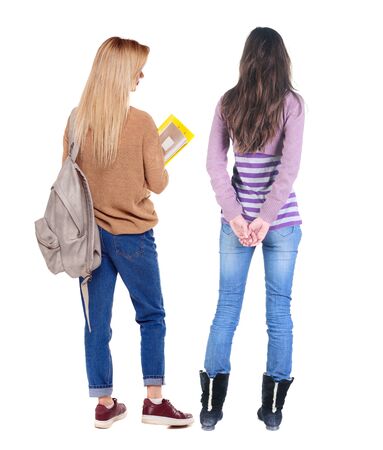 Back view of two woman in sweater. beautiful friendly girl and guy together. Rear view people collection. backside view of person. Isolated over white background.の写真素材