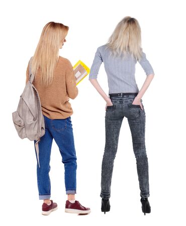Back view of two woman in sweater. beautiful friendly girl and guy together. Rear view people collection. backside view of person. Isolated over white background.の写真素材