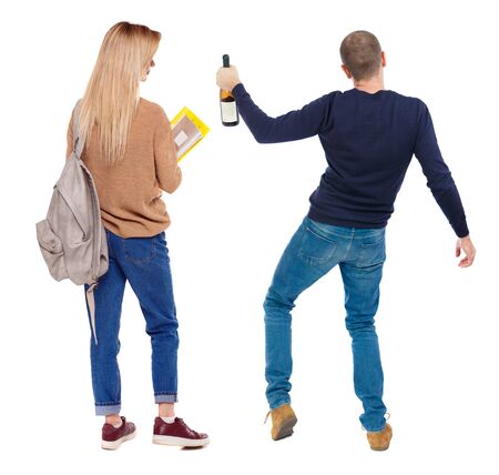 Back view of couple in sweater. beautiful friendly girl and guy together. Rear view people collection. backside view of person. Isolated over white background.の写真素材