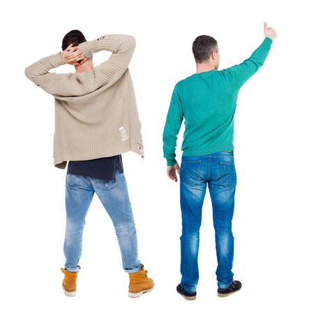 Back view of two man in sweater showing thumb up. Rear view people collection. backside view of person. Isolated over white background.の写真素材