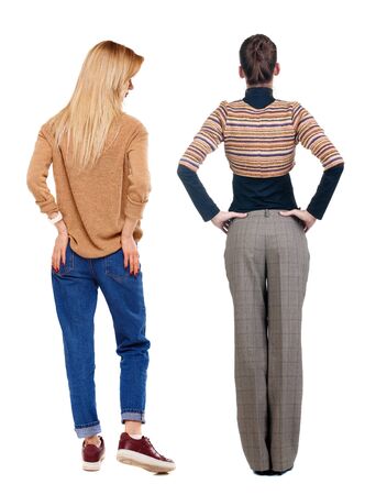 Back view of two woman in sweater. beautiful friendly girl and guy together. Rear view people collection. backside view of person. Isolated over white background.の写真素材