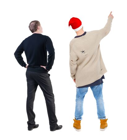 Back view of two man in sweater pointing. Rear view people collection. backside view of person. Isolated over white background.の写真素材