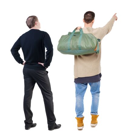 Back view of two man in sweater pointing. Rear view people collection. backside view of person. Isolated over white background.の写真素材