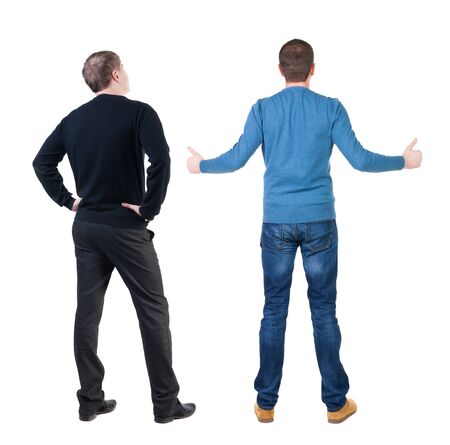 Back view of two man in sweater showing thumb up. Rear view people collection. backside view of person. Isolated over white background.の写真素材