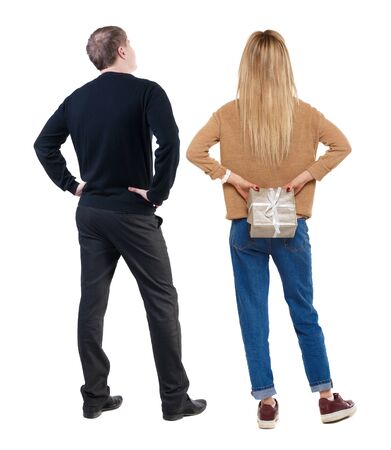 Back view of couple in sweater. beautiful friendly girl and guy together. Rear view people collection. backside view of person. Isolated over white background.の写真素材