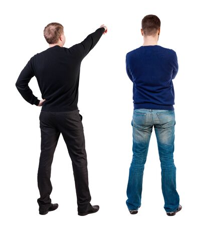 Back view of two man in sweater pointing. Rear view people collection. backside view of person. Isolated over white background.の写真素材