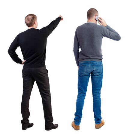 Back view of two man in sweater with mobile phone. Rear view people collection. backside view of person. Isolated over white background.の写真素材