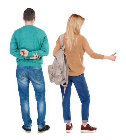 Back view of couple couple in sweater showing thumbs up. beautiful friendly girl and guy together. Rear view people collection. backside view of person. Isolated over white background.の写真素材