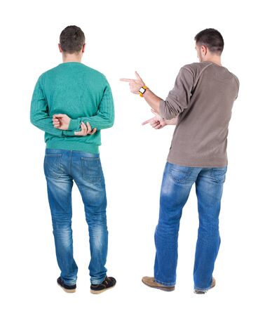 Back view of two man in sweater pointing. Rear view people collection. backside view of person. Isolated over white background.の写真素材