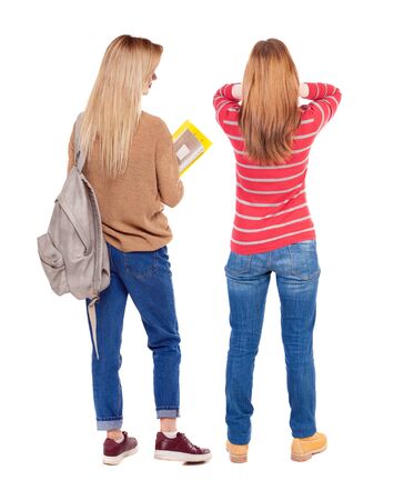 Back view of two woman in sweater. beautiful friendly girl and guy together. Rear view people collection. backside view of person. Isolated over white background.の写真素材