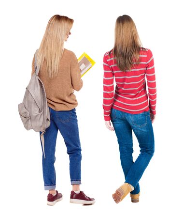Back view of two woman in sweater. beautiful friendly girl and guy together. Rear view people collection. backside view of person. Isolated over white background.の写真素材