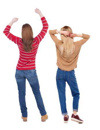 Back view of two woman in sweater. beautiful friendly girl and guy together. Rear view people collection. backside view of person. Isolated over white background.の写真素材