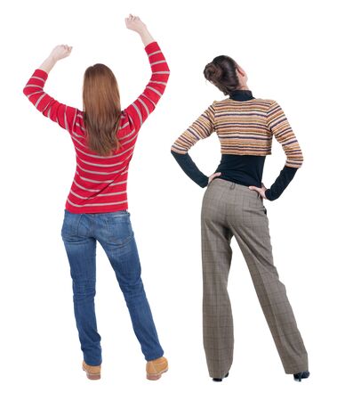 Back view of two woman in sweater. beautiful friendly girl and guy together. Rear view people collection. backside view of person. Isolated over white background.の写真素材