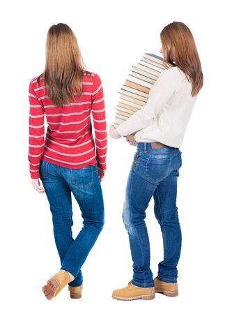 Back view of two woman in sweater. beautiful friendly girl and guy together. Rear view people collection. backside view of person. Isolated over white background.の写真素材
