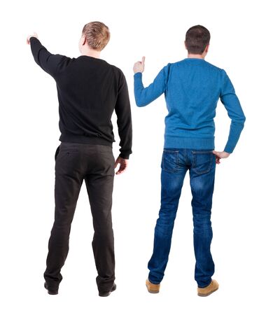 Back view of two man in sweater pointing. Rear view people collection. backside view of person. Isolated over white background.の写真素材