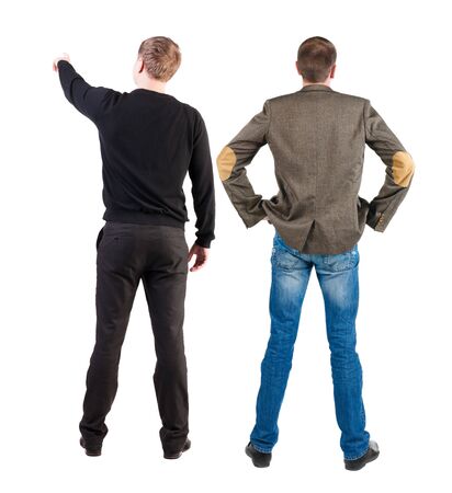 Back view of two man in sweater pointing. Rear view people collection. backside view of person. Isolated over white background.の写真素材
