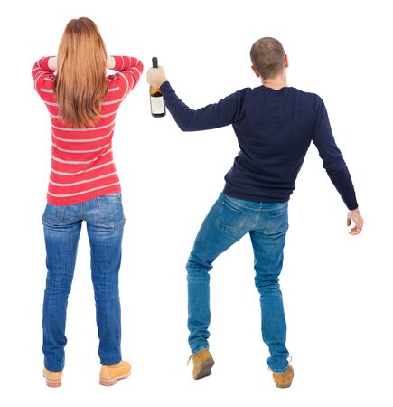 Back view of couple in sweater. beautiful friendly girl and guy together. Rear view people collection. backside view of person. Isolated over white background.の写真素材