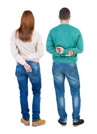 Back view of couple in sweater. beautiful friendly girl and guy together. Rear view people collection. backside view of person. Isolated over white background.の写真素材