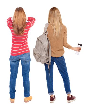 Back view of two woman in sweater. beautiful friendly girl and guy together. Rear view people collection. backside view of person. Isolated over white background.の写真素材