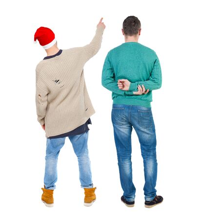 Back view of two man in sweater pointing. Rear view people collection. backside view of person. Isolated over white background.の写真素材