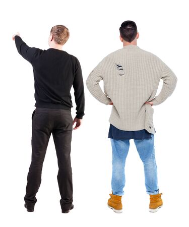 Back view of two man in sweater pointing. Rear view people collection. backside view of person. Isolated over white background.の写真素材