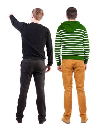 Back view of two man in sweater pointing. Rear view people collection. backside view of person. Isolated over white background.の写真素材
