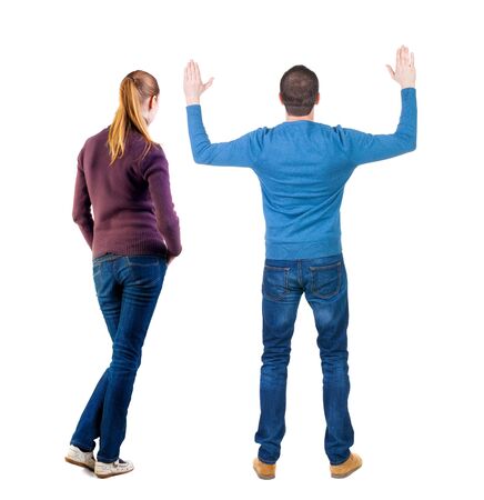 Back view of couple in sweater. beautiful friendly girl and guy together. Rear view people collection. backside view of person. Isolated over white background.の写真素材