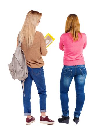 Back view of two woman in sweater. beautiful friendly girl and guy together. Rear view people collection. backside view of person. Isolated over white background.の写真素材